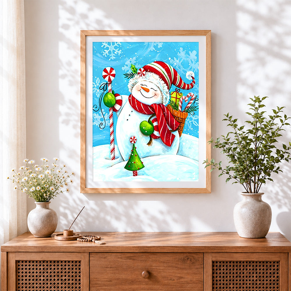 Finished cute snowman with candy cane cross stitch artwork displayed