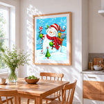 Cute snowman with candy cane cross stitch artwork displayed on wall as home decor