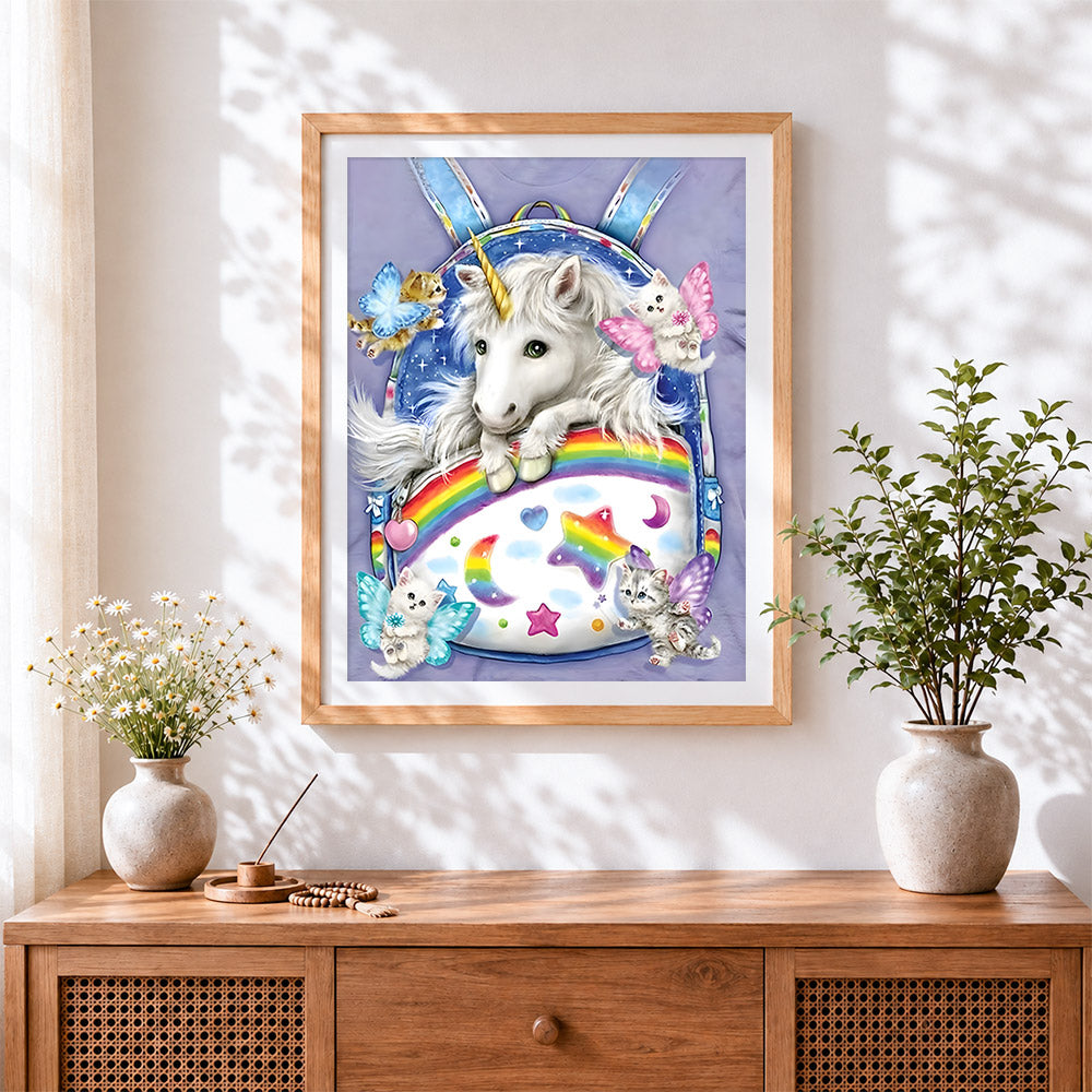 Finished cute unicorn and kittens in a backpack cross stitch artwork displayed