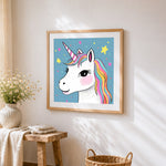 Cute unicorn and little starts cross stitch artwork displayed on wall as home decor