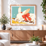 Finished cute white bunny sleeping on a piano cross stitch artwork displayed