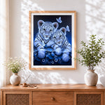 Finished cute white tiger cubs and butterflies cross stitch artwork displayed