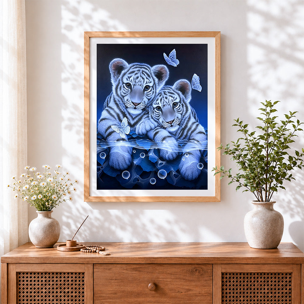 Finished cute white tiger cubs and butterflies cross stitch artwork displayed