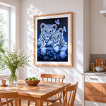 Cute white tiger cubs and butterflies cross stitch artwork displayed on wall as home decor