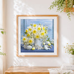Finished daffodils and easter eggs cross stitch artwork displayed
