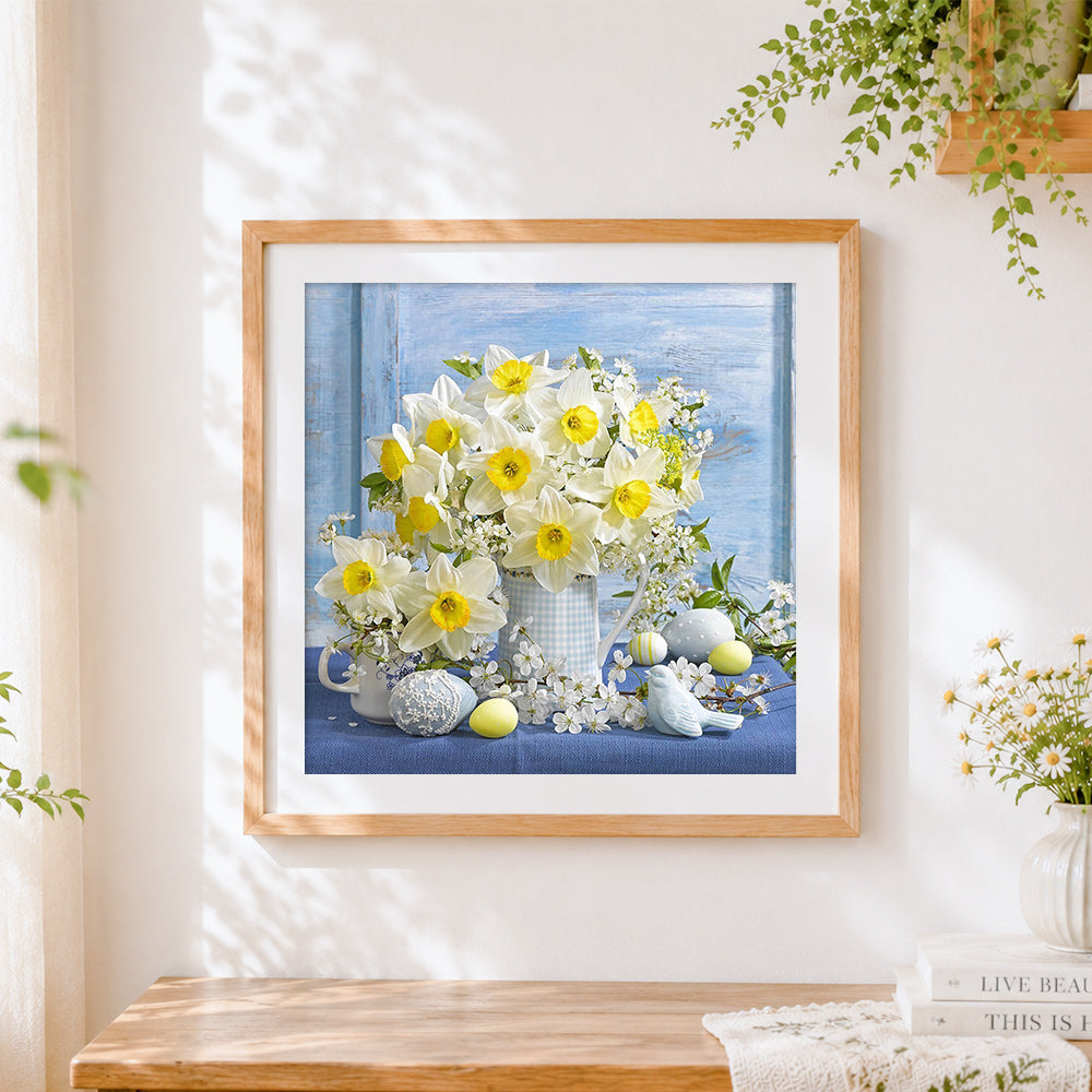 Finished daffodils and easter eggs cross stitch artwork displayed