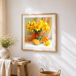 Daffodils and oranges still life cross stitch artwork displayed on wall as home decor