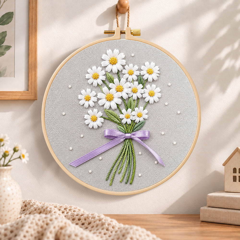Daisy bouquet with purple ribbon embroidery hoop wall art displayed as warm and cosy handmade home decor