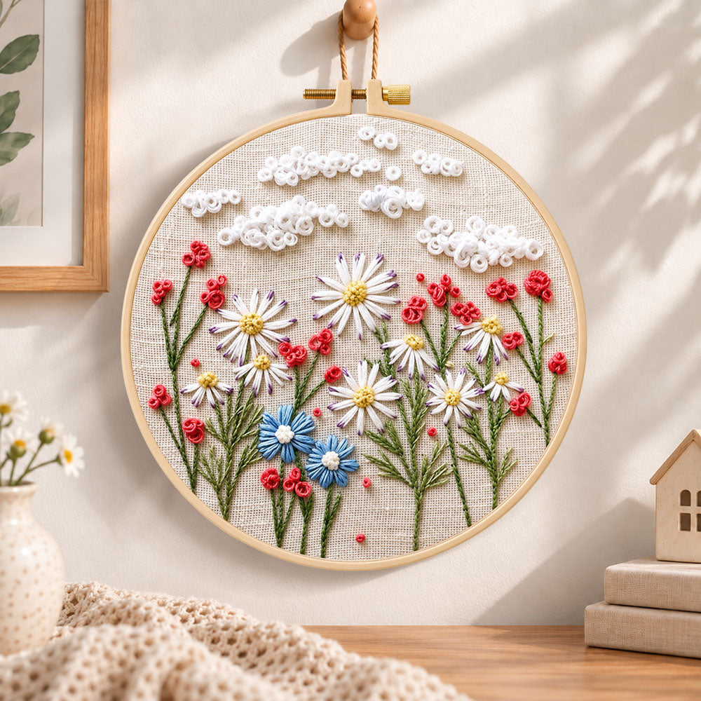 Daisy garden with clouds embroidery hoop wall art displayed as warm and cosy handmade home decor