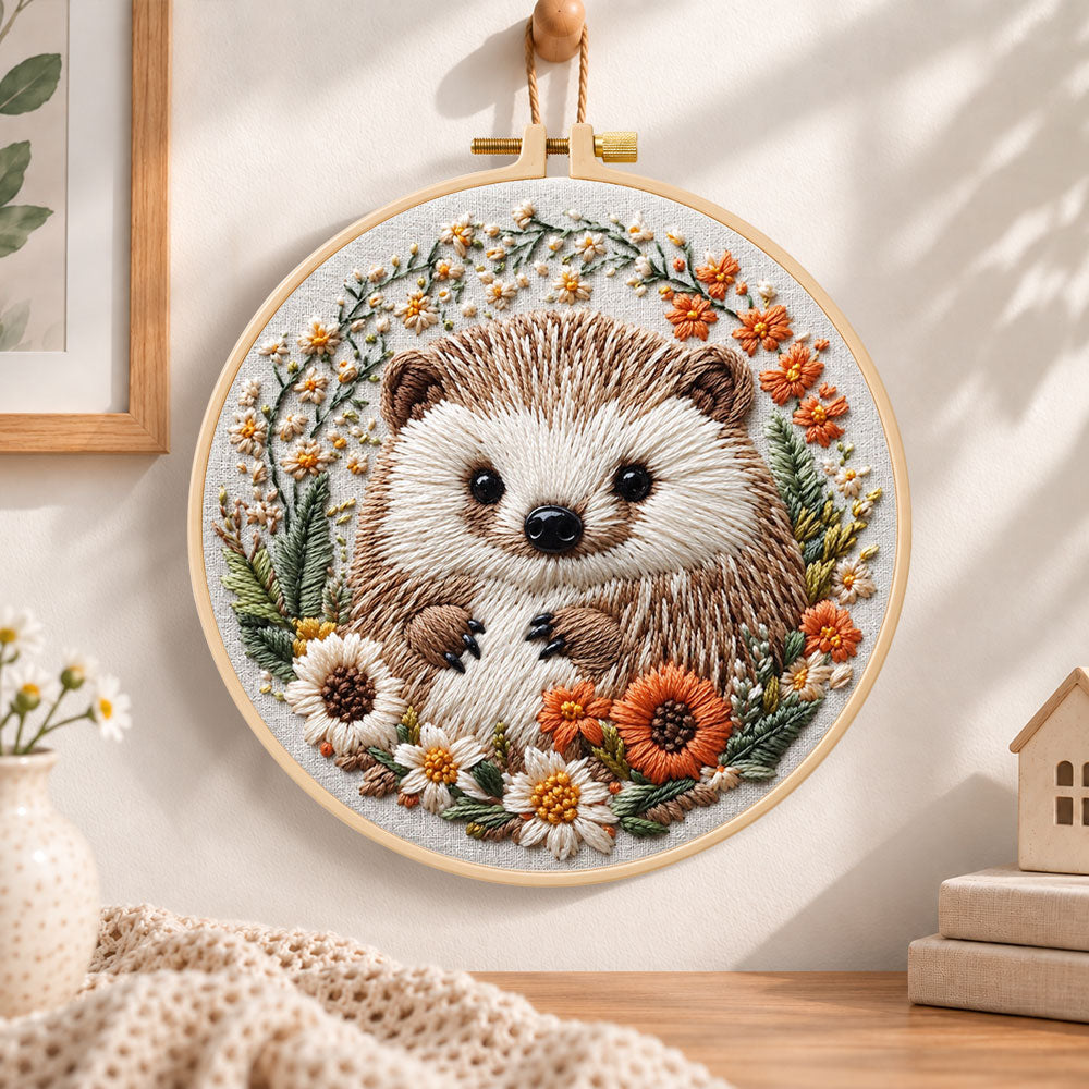 Daisy wreath hedgehog embroidery hoop wall art displayed as warm and cozy handmade home decor