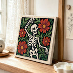 Dancing floral skeleton punch needle artwork displayed on a table