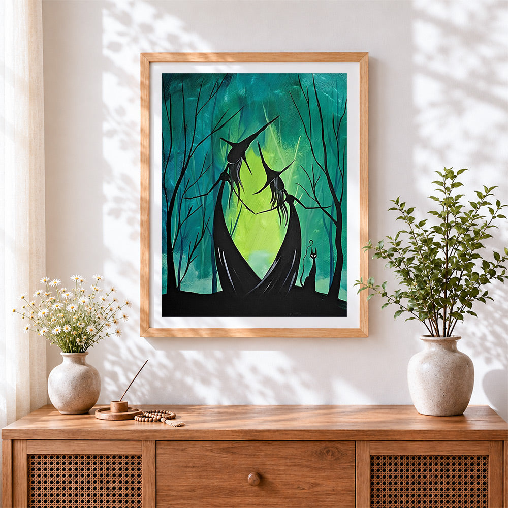 Finished dancing witches in a green forest cross stitch artwork displayed
