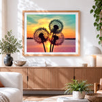 Finished dandelion silhouette at sunset cross stitch artwork displayed