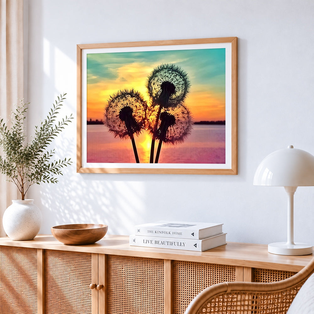 Dandelion silhouette at sunset cross stitch artwork displayed on wall as home decor