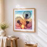 Dandelion silhouettes at sunset cross stitch artwork displayed on wall as home decor