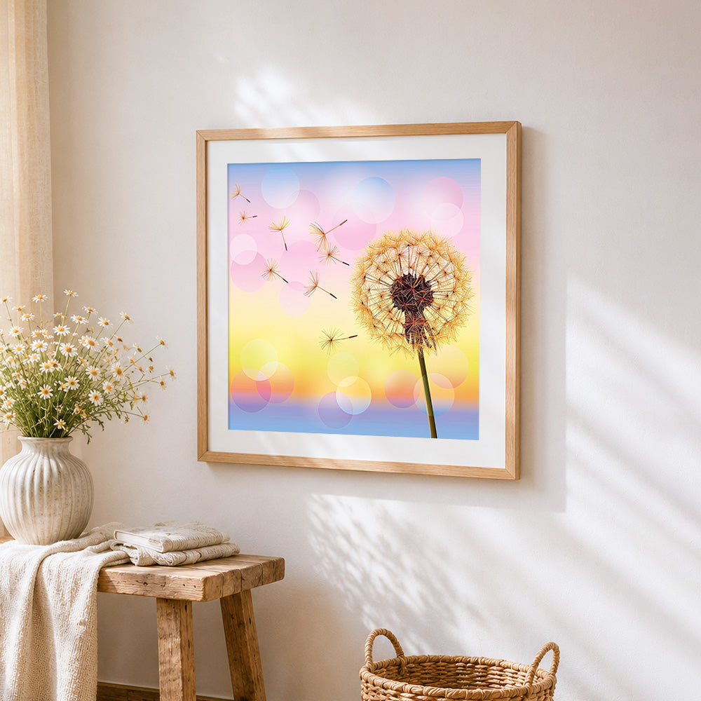 Dandelion with floating seeds cross stitch artwork displayed on wall as home decor