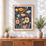 Finished dark floral pattern cross stitch artwork displayed