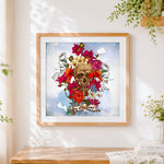 Finished day of the dead skull and flowers cross stitch artwork displayed