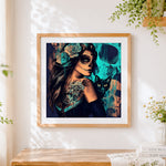 Finished day of the dead woman with black cat cross stitch artwork displayed