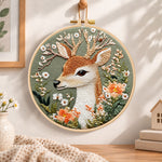 Deer and wild daisies embroidery hoop wall art displayed as warm and cosy handmade home decor
