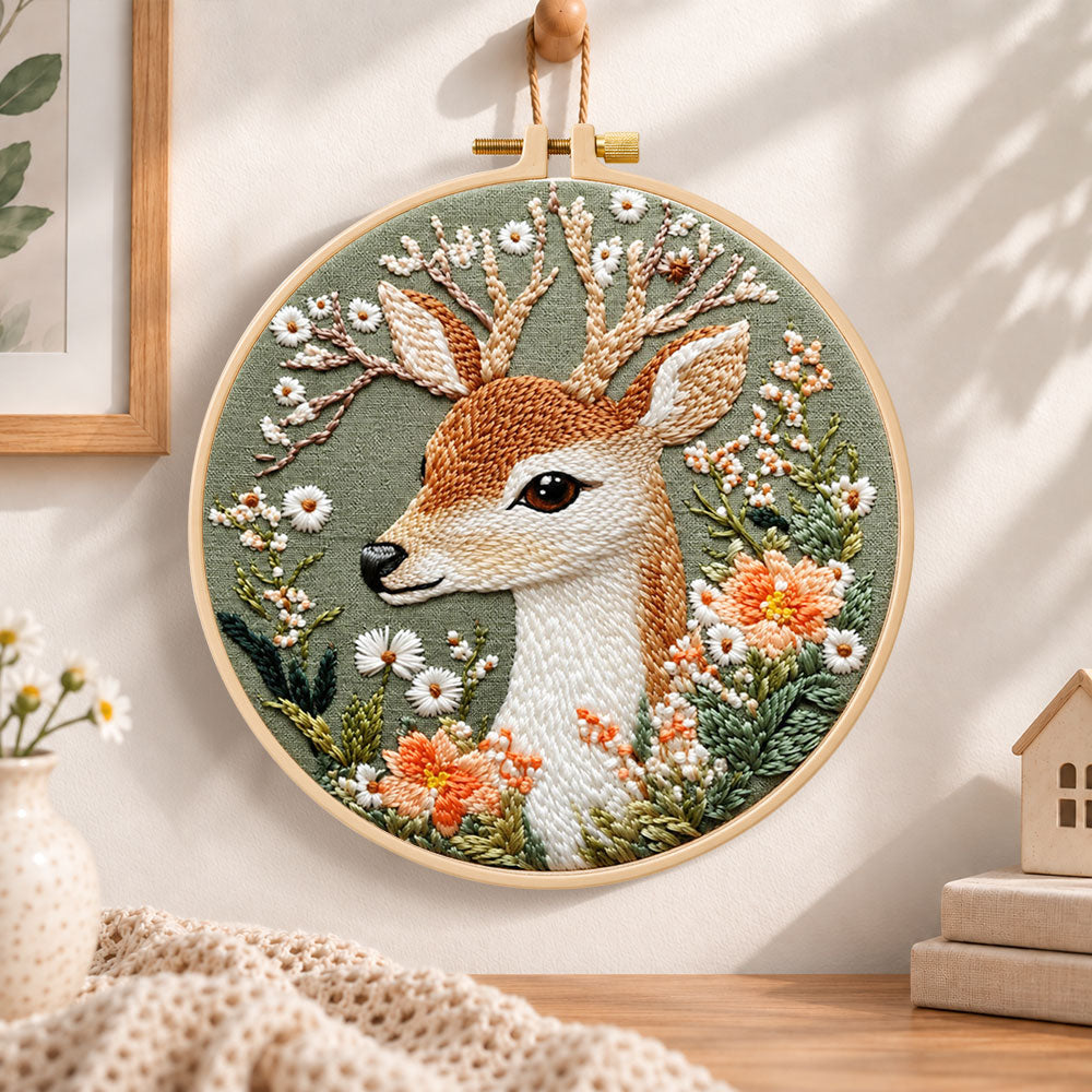 Deer and wild daisies embroidery hoop wall art displayed as warm and cosy handmade home decor