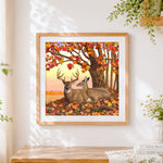 Finished deer family under autumn maple tree cross stitch artwork displayed