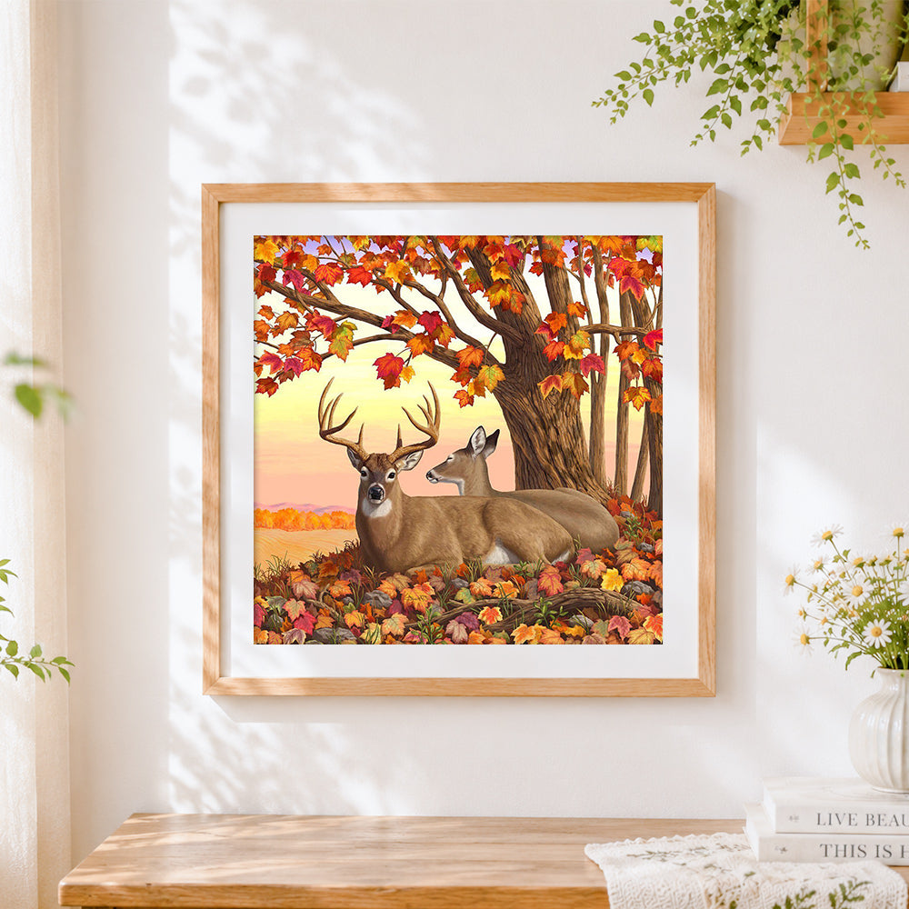 Finished deer family under autumn maple tree cross stitch artwork displayed