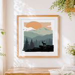 Finished deer in forest with mountains cross stitch artwork displayed