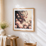 Deer in pink ranunculus cross stitch artwork displayed on wall as home decor