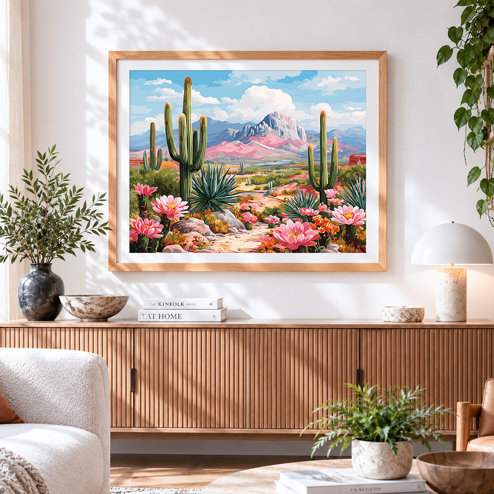 Finished desert cactus and mountains cross stitch artwork displayed