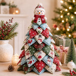 DIY quilted Christmas tree kit with snowman topper and red blue green winter fabric