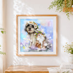 Finished dog and cat with flower crowns cross stitch artwork displayed