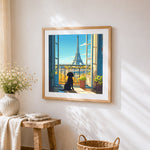 Dog looking at the eiffel tower cross stitch artwork displayed on wall as home decor