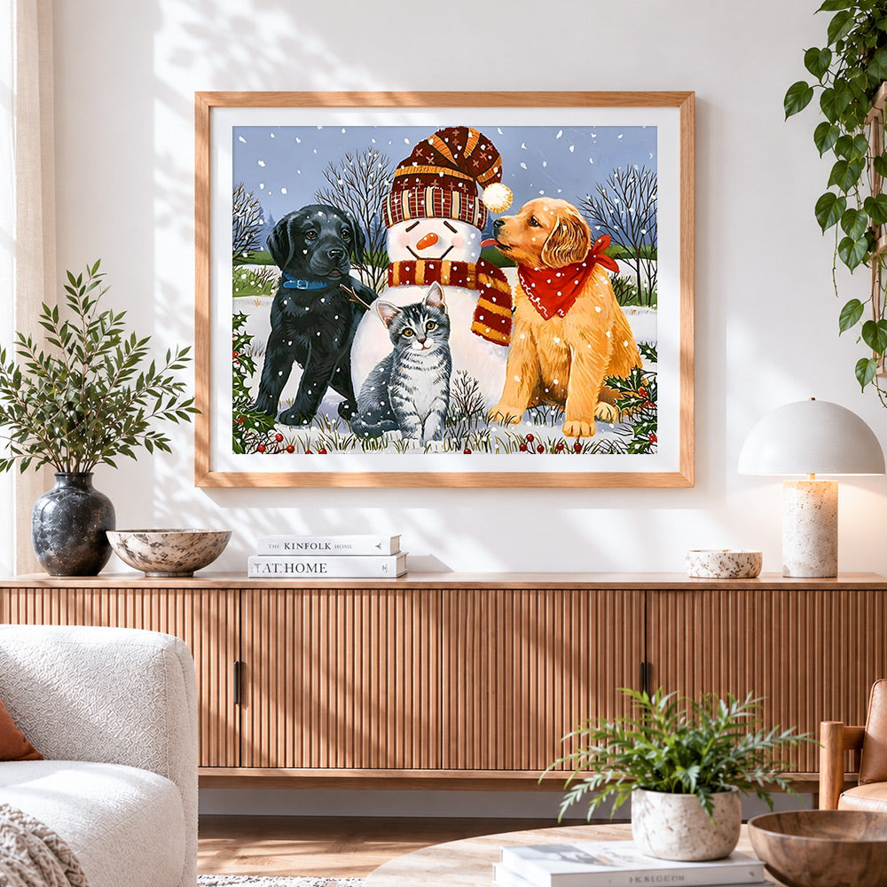 Finished dogs, cat and snowman cross stitch artwork displayed