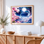 Dolphin couple and cherry blossom cross stitch artwork displayed on wall as home decor