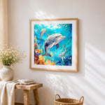 Dolphin family in coral reef cross stitch artwork displayed on wall as home decor