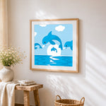 Dolphins jumping in the ocean cross stitch artwork displayed on wall as home decor