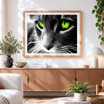 Finished dramatic cat with neon green eyes cross stitch artwork displayed