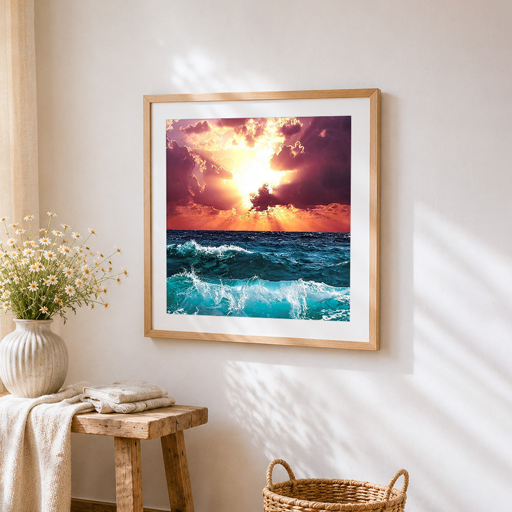 Dramatic ocean waves at sunset cross stitch artwork displayed on wall as home decor