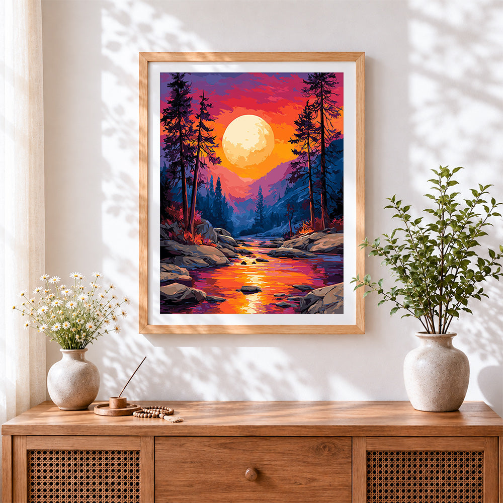 Finished dramatic sunset over river cross stitch artwork displayed
