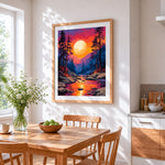Dramatic sunset over river cross stitch artwork displayed on wall as home decor