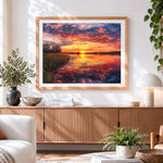 Finished dramatic sunset over wetlands cross stitch artwork displayed