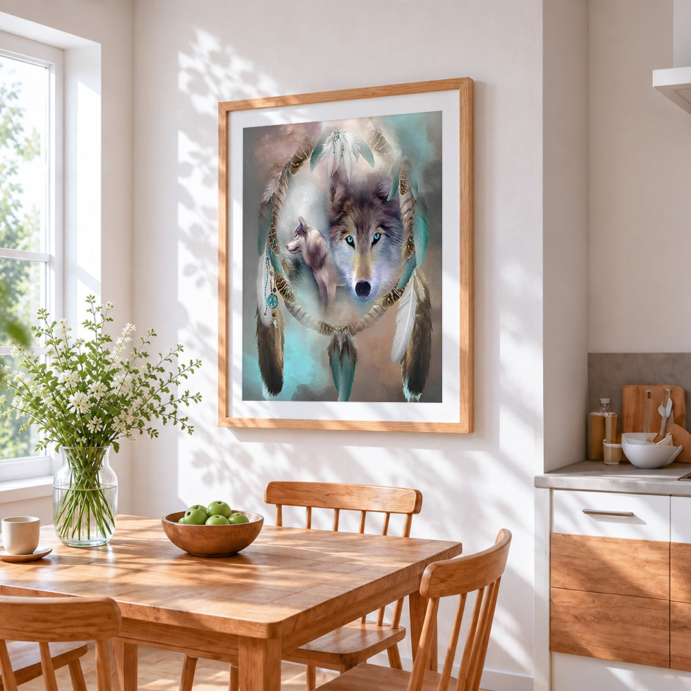Dreamcatcher and wolf cross stitch artwork displayed on wall as home decor