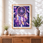 Finished dreamcatcher in starry night sky cross stitch artwork displayed