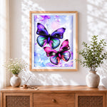 Finished dreamy flying butterflies cross stitch artwork displayed