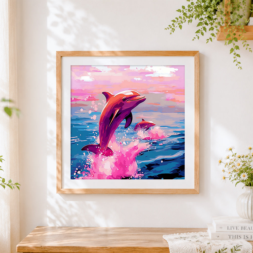 Finished dreamy pink dolphins cross stitch artwork displayed