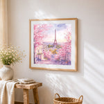 Dreamy pink eiffel tower cross stitch artwork displayed on wall as home decor