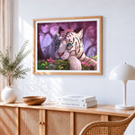 Dreamy white tiger with pink petals cross stitch artwork displayed on wall as home decor