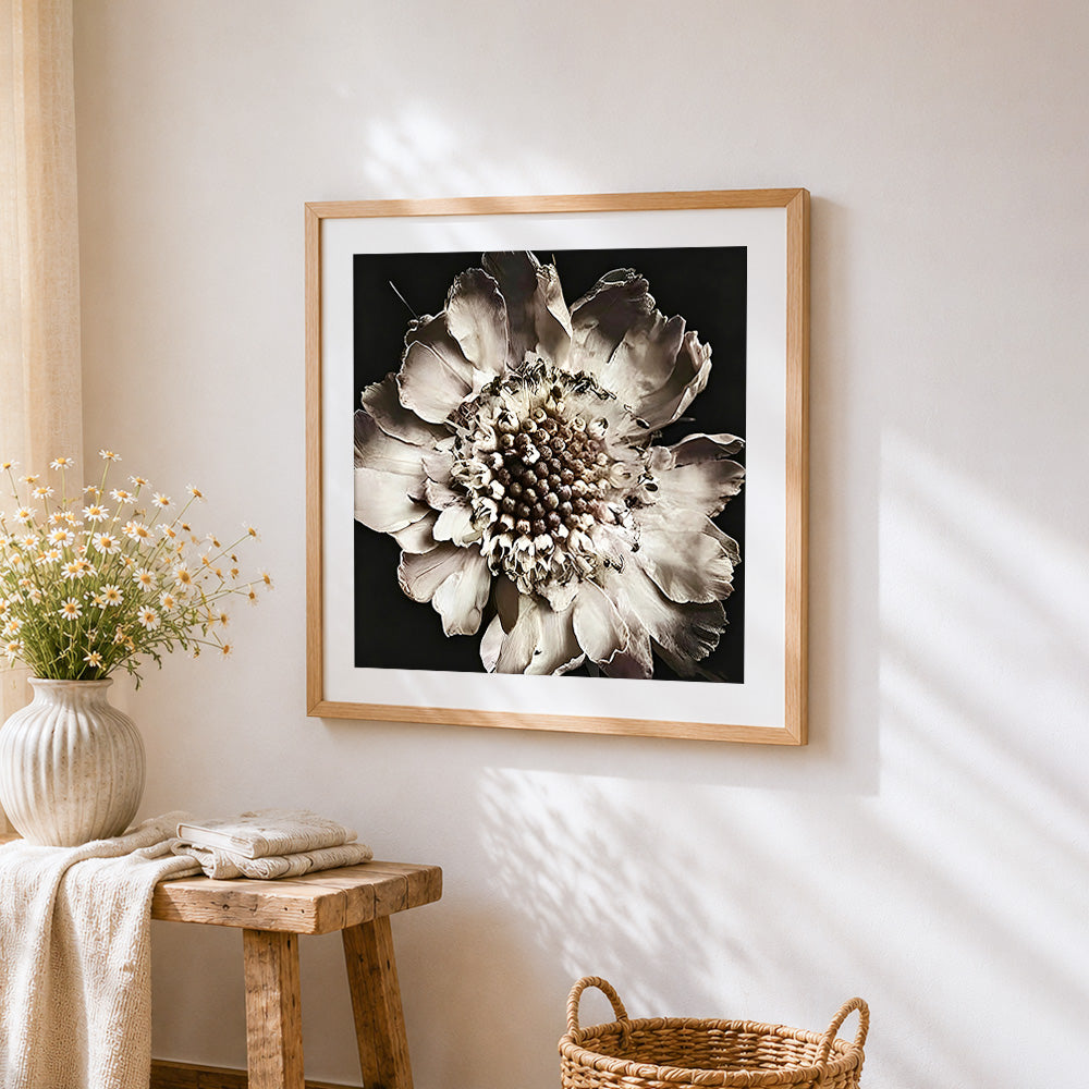 Dried white flower close up cross stitch artwork displayed on wall as home decor