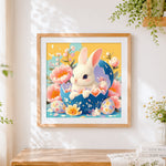 Finished easter bunny in a blue egg cross stitch artwork displayed